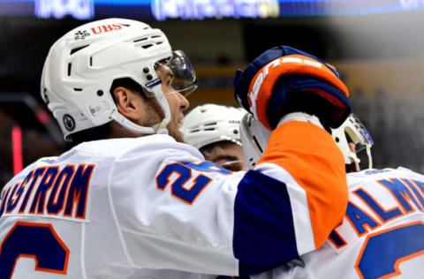 Oliver Wahlstrom #26 celebrates with Kyle Palmieri #21 of the New York Islanders. (Photo by Emilee Chinn/Getty Images)