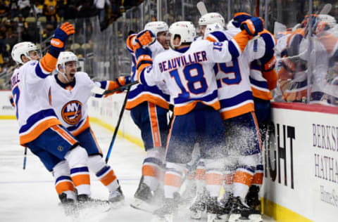 The New York Islanders celebrate the game winning goal by Josh Bailey #12 during the second overtime period in Game Five of the First Round of the 2021 Stanley Cup Playoffs. (Photo by Emilee Chinn/Getty Images)