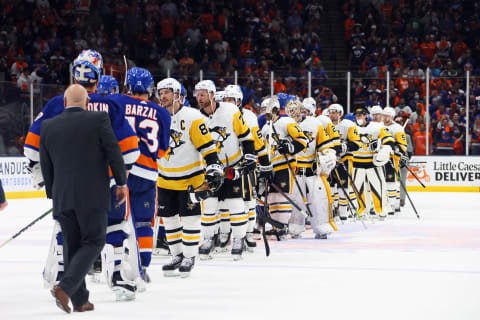 The Pittsburgh Penguins and the New York Islanders shake hands following the Islanders 5-3 victory. (Photo by Bruce Bennett/Getty Images)