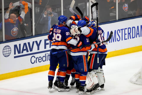 UNIONDALE, NEW YORK – JUNE 19: The New York Islanders celebrate their 3-2 win over the Tampa Bay Lightning after Game Four of the Stanley Cup Semifinals during the 2021 Stanley Cup Playoffs at Nassau Coliseum on June 19, 2021 in Uniondale, New York. (Photo by Rich Graessle/Getty Images)