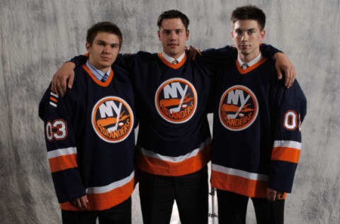 NASHVILLE, TN – JUNE 21: (L to R) Dimitri Chernykh (#48 overall), Evgeni Tunik (#53 overall) and Jeremy Colliton (#58 overall) the second round draft picks of the New York Islanders pose for a portrait after the 2003 NHL Entry Draft at the Gaylord Entertainment Center on June 21, 2003 in Nashville, Tennessee. (Photo by Dave Sandford/Getty Images/NHLI)