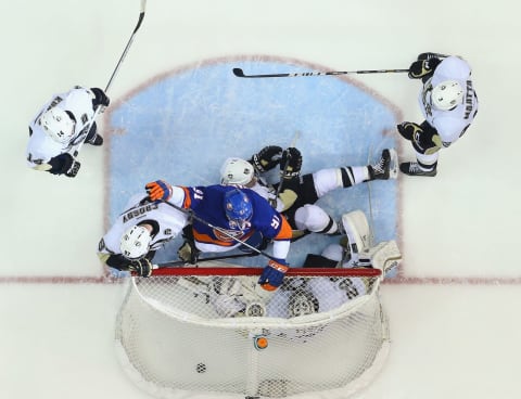 John Tavares #91 of the New York Islanders celebrates a goal by Kyle Okposo. (Photo by Bruce Bennett/Getty Images)