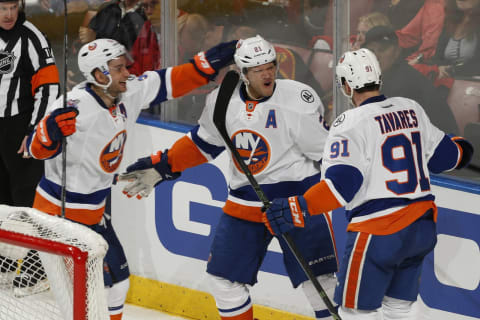 SUNRISE, FL – APRIL 14: Kyle Okposo #21 is congratulated by Frans Nielsen #51 and John Tavares #91 of the New York Islanders after scoring a third period goal against the Florida Panthers in Game One of the Eastern Conference Quarterfinals during the NHL 2016 Stanley Cup Playoffs at the BB&T Center on April 14, 2016 in Sunrise, Florida. The Islanders defeated the Panthers 5-4. (Photo by Joel Auerbach/Getty Images)