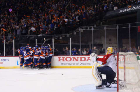 NEW YORK, NEW YORK – APRIL 17: The New York Islanders celebrate the game winning overtime goal by Thomas Hickey #14 against Roberto Luongo #1 of the Florida Panthers during Game Three of the Eastern Conference Quarterfinals during the 2015 NHL Stanley Cup Playoffs at the Barclays Center on April 17, 2016 in the Brooklyn borough of New York City. The Islanders defeated the Panthers 4-3 in overtime. (Photo by Bruce Bennett/Getty Images)