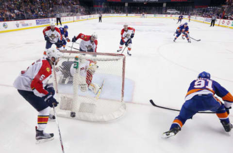 NEW YORK, NY – APRIL 24: John Tavares #91 of the New York Islanders scores the game winning goal at 10:41 of the second overtime against Roberto Luongo #1 of the Flrorida Panthers in Game Six of the Eastern Conference First Round during the 2016 NHL Stanley Cup Playoffs at the Barclays Center on April 24, 2016 in the Brooklyn borough of New York City. The Islanders won the game 2-1 in double overtime to win the series four games to two. (Photo by Bruce Bennett/Getty Images)