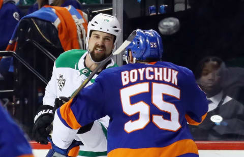 NEW YORK, NY – DECEMBER 13: Jamie Benn #14 of the Dallas Stars goes up against Johnny Boychuk #55 of the New York Islanders at the Barclays Center on December 13, 2017 in the Brooklyn borough of New York City. The Stars defeated the Islanders 5-2. (Photo by Bruce Bennett/Getty Images)