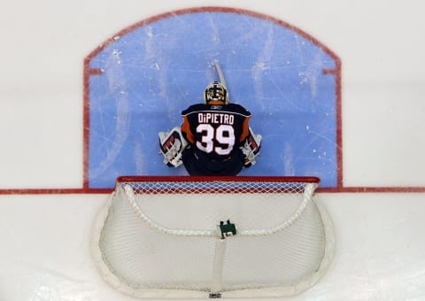 UNIONDALE, NY – JANUARY 18: Rick DiPietro #39 of the New York Islanders prepares to play against the New Jersey Devils on January 18, 2010 at Nassau Coliseum in Uniondale, New York. The Isles defeated the Devils 4-0. (Photo by Jim McIsaac/Getty Images)