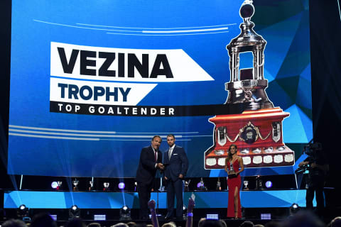 LAS VEGAS, NV – JUNE 20: Actor Jim Belushi (L) and accountant Scott Foster, who appeared in one game for the Chicago Blackhawks in March as an emergency backup goaltender, present the Vezina Trophy onstage at the 2018 NHL Awards presented by Hulu at The Joint inside the Hard Rock Hotel & Casino on June 20, 2018 in Las Vegas, Nevada. (Photo by Ethan Miller/Getty Images)