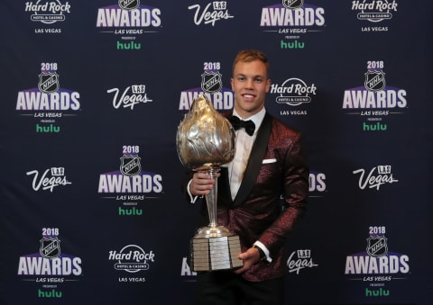 LAS VEGAS, NV – JUNE 20: Taylor Hall of the New Jersey Devils poses with the Hart Trophy given to the most valuable player to his team in the press room at the 2018 NHL Awards presented by Hulu at the Hard Rock Hotel & Casino on June 20, 2018 in Las Vegas, Nevada. (Photo by Bruce Bennett/Getty Images)