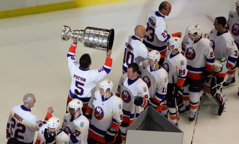 UNIONDALE, NY – MARCH 02: Former New York Islanders legend Denis Potvin carries the Stanley Cup before the game against the Florida Panthers at the Nassau Coliseum March 2, 2008 in Uniondale, New York. The Islanders are celebrating the 17 men that were part of all four Stanley Cup winning teams from 1980-1983. (Photo by Jim McIsaac/Getty Images)