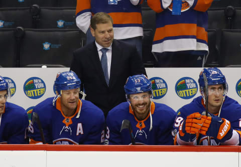 NEW YORK, NY – SEPTEMBER 25: Head coach Doug Weight of the New York Islanders handles bench duties against the New Jersey Devils during a preseason game at the Barclays Center on September 25, 2017 in the Brooklyn borough of New York City. The Islanders shut out the Devils 3-0. (Photo by Bruce Bennett/Getty Images)