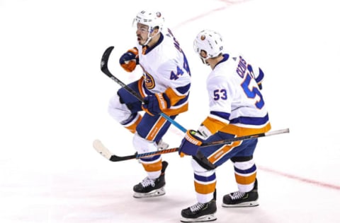 Jean-Gabriel Pageau #44 of the New York Islanders is congratulated by his teammate, Casey Cizikas #53. (Photo by Elsa/Getty Images)