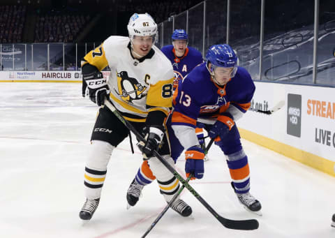 Sidney Crosby #87 of the Pittsburgh Penguins skates against Mathew Barzal #13 of the New York Islanders. (Photo by Bruce Bennett/Getty Images)