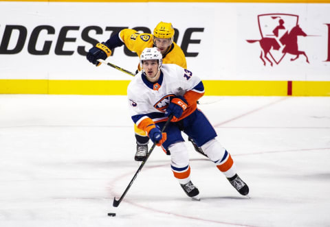 NASHVILLE, TN – OCTOBER 13: Mathew Barzal #13 of the New York Islanders tangles with Ryan Johansen #92 of the Nashville Predators during a NHL game at Bridgestone Arena on October 13, 2018 in Nashville, Tennessee. (Photo by Ronald C. Modra/NHL/Getty Images)