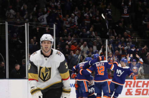 UNIONDALE, NEW YORK – DECEMBER 05: The New York Islanders celebrate the game winning overtime goal by Ryan Pulock #6 against the Vegas Golden Knights at NYCB Live’s Nassau Coliseum on December 05, 2019 in Uniondale, New York. The Islanders defeated the Golden Knights 3-2 in overtime. (Photo by Bruce Bennett/Getty Images)