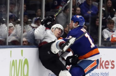 UNIONDALE, NEW YORK – JANUARY 06: Matt Martin #17 of the New York Islanders checks Matt Calvert #11 of the Colorado Avalanche during the second period at NYCB Live’s Nassau Coliseum on January 06, 2020 in Uniondale, New York. The Islanders shut-out to Avalanche 1-0. (Photo by Bruce Bennett/Getty Images)