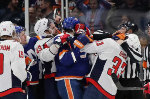 UNIONDALE, NEW YORK – JANUARY 18: Tom Wilson #43 and Radko Gudas #33 of the Washington Capitals combine to hold off Matt Martin #17 of the New York Islanders during the second period at NYCB Live’s Nassau Coliseum on January 18, 2020 in Uniondale, New York. (Photo by Bruce Bennett/Getty Images)