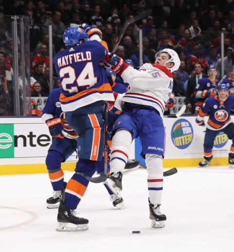 UNIONDALE, NEW YORK – MARCH 14: Scott Mayfield #24 of the New York Islanders checks Jesperi Kotkaniemi #15 of the Montreal Canadiens during the third period at NYCB Live’s Nassau Coliseum on March 14, 2019 in Uniondale, New York. The Islanders defeated the Canadiens 2-1. (Photo by Bruce Bennett/Getty Images)