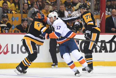 PITTSBURGH, PA – APRIL 14: Matt Martin #17 of the New York Islanders battles with Jack Johnson #73 of the Pittsburgh Penguins during the first period in Game Three of the Eastern Conference First Round during the 2019 NHL Stanley Cup Playoffs at PPG PAINTS Arena on April 14, 2019 in Pittsburgh, Pennsylvania. (Photo by Justin Berl/Getty Images)