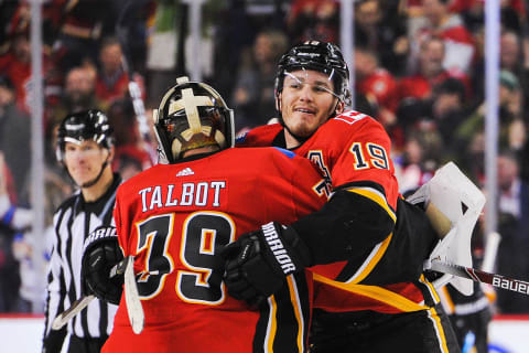 CALGARY, AB – MARCH 4: Cameron Talbot #39 and Matthew Tkachuk #19 of the Calgary Flames celebrate after defeating the Columbus Blue Jackets in overtime during an NHL game at Scotiabank Saddledome on March 4, 2020 in Calgary, Alberta, Canada. (Photo by Derek Leung/Getty Images)