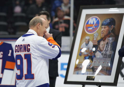 UNIONDALE, NEW YORK – FEBRUARY 29: Former New York Islander Butch Goring is honored by the team as his #91 jersey is retired and hung in the rafters prior to the game between the Islanders and the Boston Bruins at NYCB Live’s Nassau Coliseum on February 29, 2020 in Uniondale, New York. (Photo by Bruce Bennett/Getty Images)