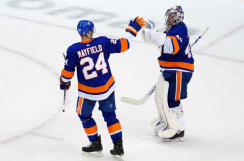 Scott Mayfield #24 and Semyon Varlamov #40 of the New York Islanders. (Photo by Andre Ringuette/Freestyle Photo/Getty Images)