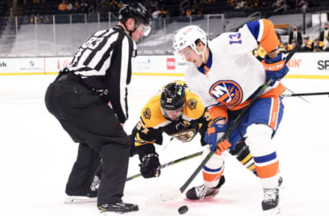 Boston Bruins center Patrice Bergeron (37) and New York Islanders center Mathew Barzal (13). Mandatory Credit: Bob DeChiara-USA TODAY Sports