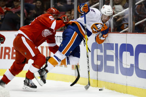 Feb 3, 2017; Detroit, MI, USA; Detroit Red Wings defenseman Niklas Kronwall (55) checks New York Islanders left wing Anthony Beauvillier (72) into the boards during the second period at Joe Louis Arena. Mandatory Credit: Rick Osentoski-USA TODAY Sports