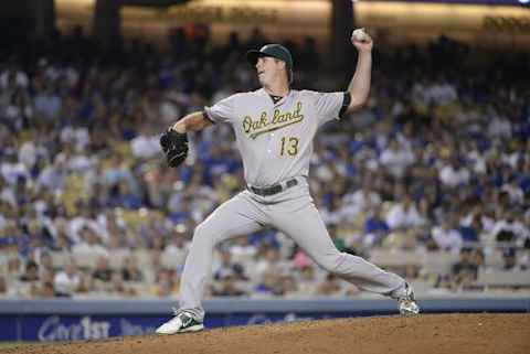 Jul 29, 2015; Los Angeles, CA, USA; Oakland Athletics relief pitcher Drew Pomeranz (13) pitches against the Los Angeles Dodgers during the seventh inning at Dodger Stadium. Mandatory Credit: Richard Mackson-USA TODAY Sports