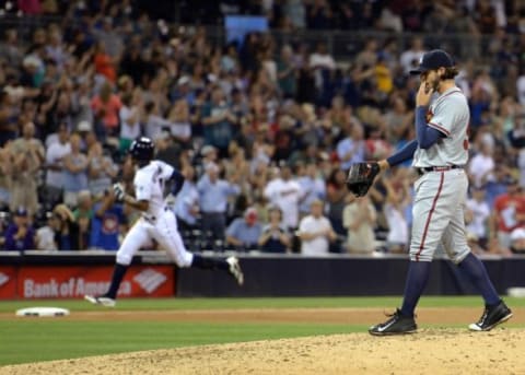 Aug 18, 2015; San Diego, CA, USA; Atlanta Braves relief pitcher Andrew McKirahan (52) reacts after giving up a two run home run to San Diego Padres center fielder Melvin Upton Jr. (background, left) during the seventh inning at Petco Park. Mandatory Credit: Jake Roth-USA TODAY Sports