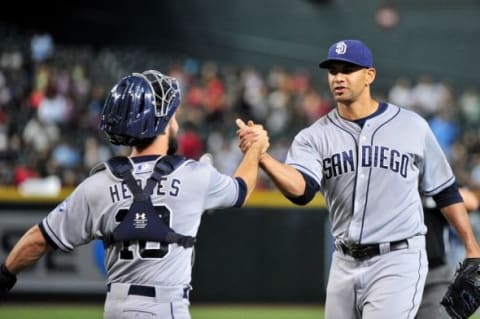 Jun 20, 2015; Phoenix, AZ, USA; San Diego Padres starting pitcher Tyson Ross (38) celebrates with catcher Austin Hedges (18) after beating the Arizona Diamondbacks 8-1 at Chase Field. Mandatory Credit: Matt Kartozian-USA TODAY Sports