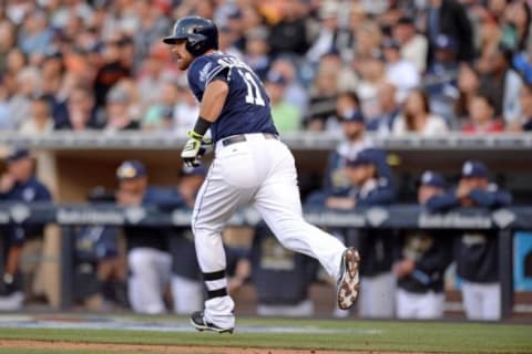 Apr 11, 2015; San Diego, CA, USA; San Diego Padres third baseman Will Middlebrooks (11) hits an RBI single during the first inning against the San Francisco Giants at Petco Park. Mandatory Credit: Jake Roth-USA TODAY Sports