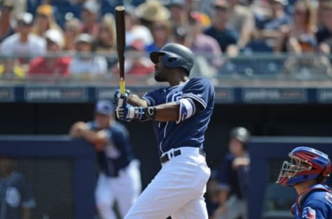 Mar 22, 2016; Peoria, AZ, USA; San Diego Padres right fielder Jabari Blash (62) hits a home run during the second inning against the Texas Rangers at Peoria Sports Complex. Mandatory Credit: Joe Camporeale-USA TODAY Sports