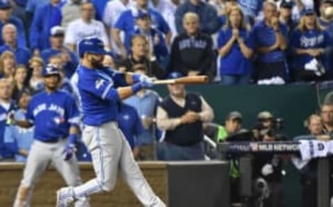 Oct 23, 2015; Kansas City, MO, USA; Toronto Blue Jays right fielder Jose Bautista hits a two-run home run against the Kansas City Royals in the 8th inning in game six of the ALCS at Kauffman Stadium. Mandatory Credit: Peter G. Aiken-USA TODAY Sports