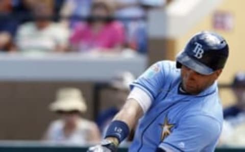 Mar 8, 2016; Lakeland, FL, USA; Tampa Bay Rays first baseman James Loney (21) hits a single during the first inning of a game against the Detroit Tigers at Joker Marchant Stadium. Mandatory Credit: Butch Dill-USA TODAY Sports