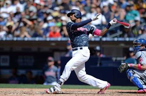 May 8, 2016; San Diego, CA, USA; San Diego Padres catcher Christian Bethancourt (12) hits a two run home run during the fifth inning against the New York Mets at Petco Park. Mandatory Credit: Jake Roth-USA TODAY Sports