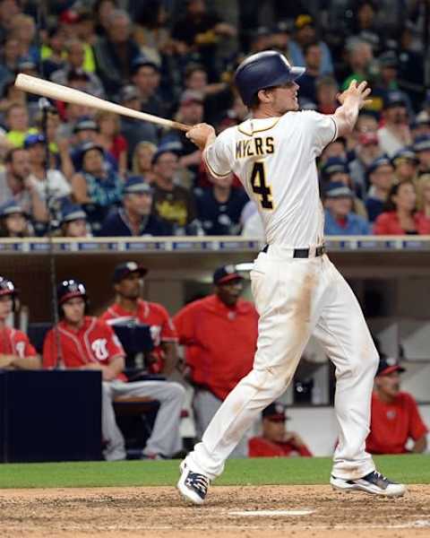 Jun 18, 2016; San Diego, CA, USA; San Diego Padres first baseman Wil Myers (4) hits a two RBI double during the eighth inning against the Washington Nationals at Petco Park. Mandatory Credit: Jake Roth-USA TODAY Sports