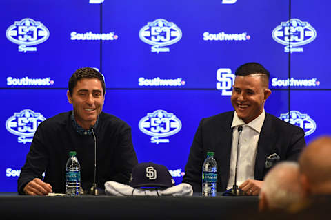 PEORIA, ARIZONA – FEBRUARY 22: Executive V.P./General Manager A.J.  Preller and Manny  Machado #8 of the San Diego Padres address the media at Peoria Stadium on February 22, 2019 in Peoria, Arizona. (Photo by Jennifer Stewart/Getty Images)