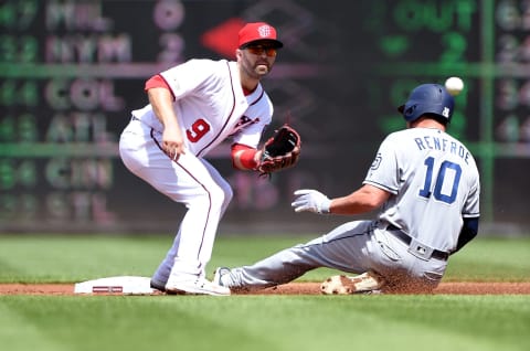 WASHINGTON, DC – APRIL 28: Hunter Renfroe #10 of the San Diego Padres steals second base ahead of the throw to Brian Dozier #9 of the Washington Nationals in the second inning at Nationals Park on April 28, 2019 in Washington, DC. (Photo by Greg Fiume/Getty Images)