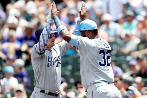 DENVER, COLORADO – JUNE 16: Hunter Renfroe #10 of the San Diego Padres celebrates with Franmil Reyes #32 after hitting 2 RBI home run in the first inning against the Colorado Rockies at Coors Field on June 16, 2019 in Denver, Colorado. (Photo by Matthew Stockman/Getty Images)