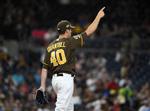 SAN DIEGO, CA – AUGUST 9: Cal Quantrill #40 of the San Diego Padres points to the outfield after Wil Myers #4 made a catch during the fourth inning of a baseball game against the Colorado Rockies at Petco Park August 9, 2019 in San Diego, California. (Photo by Denis Poroy/Getty Images)