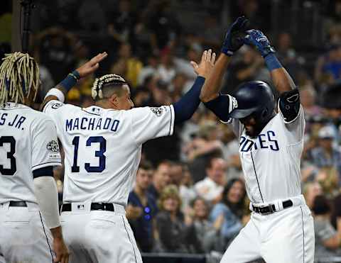 SAN DIEGO, CA – AUGUST 10: Manuel Margot #7 of the San Diego Padres is congratulated by Manny Machado #13 safter hitting a two-run home run during the eighth inning of a baseball game against the Colorado Rockies at Petco Park August 10, 2019 in San Diego, California. (Photo by Denis Poroy/Getty Images)