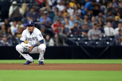 SAN DIEGO, CALIFORNIA – JULY 13: Manny Machado #13 of the San Diego Padres looks on after an RBI double by Tyler Flowers #25 of the Atlanta Braves during the tenth inning of a game at PETCO Park on July 13, 2019 in San Diego, California. (Photo by Sean M. Haffey/Getty Images)