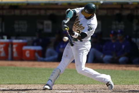 OAKLAND, CA – SEPTEMBER 22: Jurickson  Profar #23 of the Oakland Athletics connects for a single during the sixth inning against the Texas Rangers at Ring Central Coliseum on September 22, 2019 in Oakland, California. The Rangers defeated the Athletics 8-3. (Photo by Stephen Lam/Getty Images)