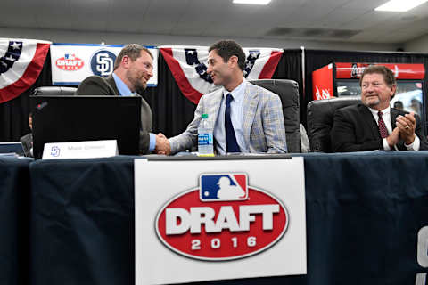 Mark Connor congratulates AJ Preller and Logan White of the San Diego Padres, California. (Photo by Andy Hayt/San Diego Padres/Getty Images)