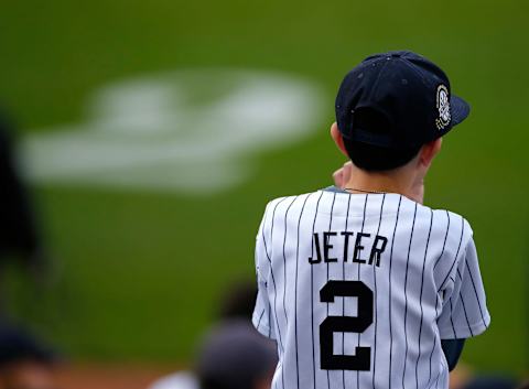 A young fan waits for former New York Yankees great, Derek Jeter. (Photo by Rich Schultz/Getty Images)