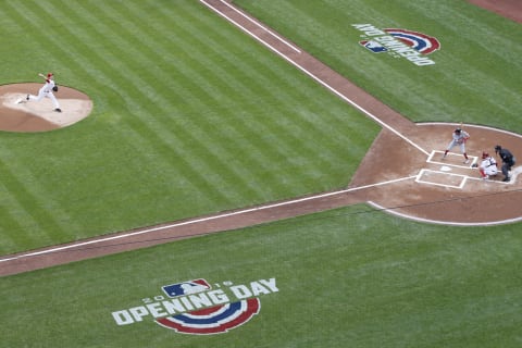 CINCINNATI, OH – MARCH 30: Padres Homer Bailey #34 of the Cincinnati Reds delivers the first pitch of the Opening Day game to Adam Eaton #2 of the Washington Nationals at Great American Ball Park on March 30, 2018 in Cincinnati, Ohio. (Photo by Joe Robbins/Getty Images)