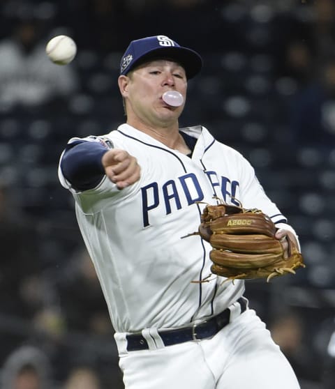 SAN DIEGO, CA – MAY 21: Ty France #11 of the San Diego Padres blows a bubble as he throws out Blake Swihart #19 of the Arizona Diamondbacks during the sixth inning of a baseball game at Petco Park May 21, 2019 in San Diego, California. (Photo by Denis Poroy/Getty Images)