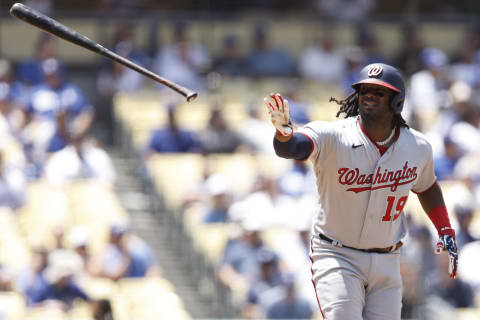 LOS ANGELES, CALIFORNIA – JULY 27: Josh Bell #19 of the Washington Nationals tosses his bat as he runs to first base after being walked against the Los Angeles Dodgers during the fourth inning at Dodger Stadium on July 27, 2022 in Los Angeles, California. (Photo by Michael Owens/Getty Images)