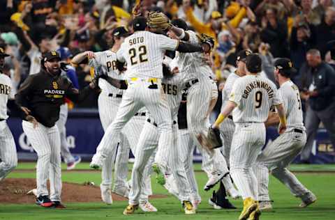 SAN DIEGO, CALIFORNIA - OCTOBER 15: The San Diego Padres celebrate defeating the Los Angeles Dodgers 5-3 in game four of the National League Division Series at PETCO Park on October 15, 2022 in San Diego, California. (Photo by Denis Poroy/Getty Images)